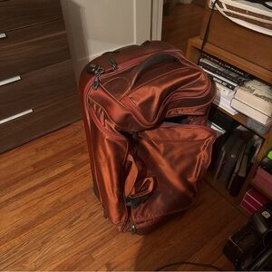 Tumi Rolling Garment Bag in Burnt Orange